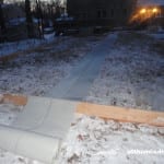 allthumbsdiy-backyard-ice-rink-day-2-rolling-out-the-plastic-sheeting-fl